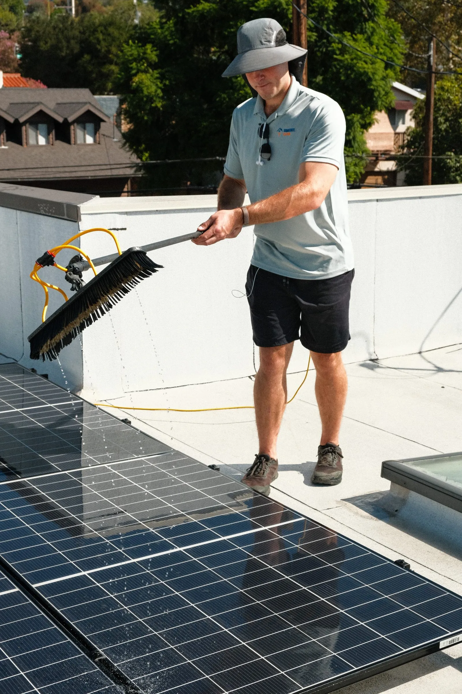 Water dripping from a brush lifted off a solar panel